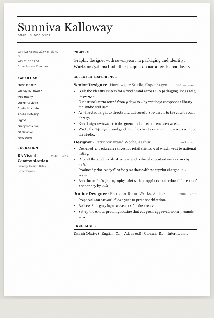 The graphic designer example résumé drawn as a complete page in the Editorial design: name, summary, the roles with their bullet lines, education and a skills row